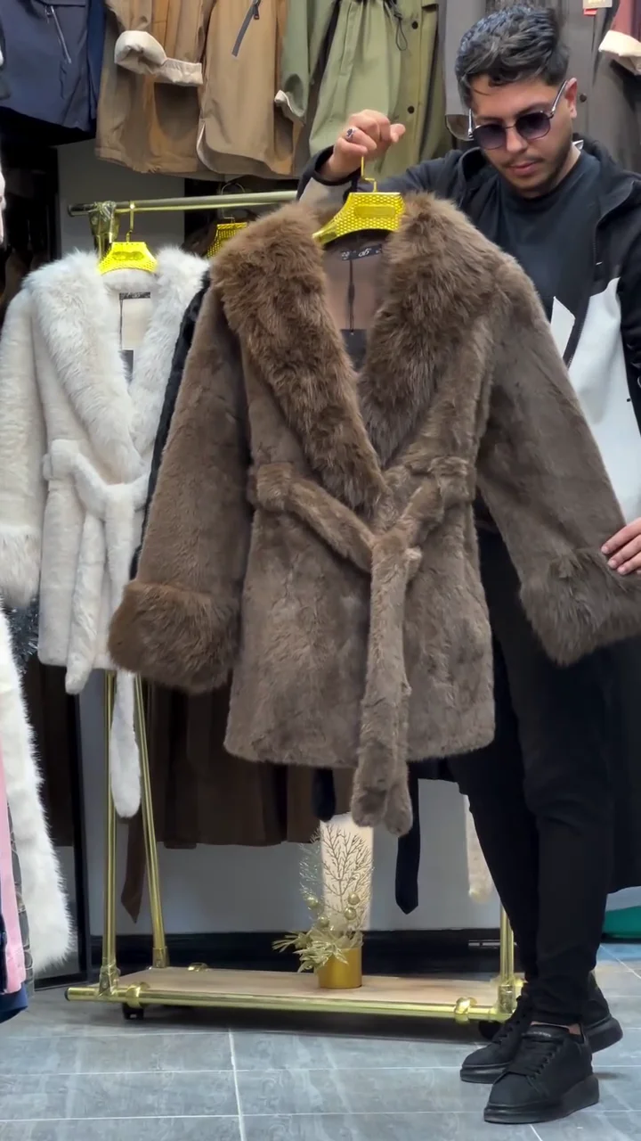 Luxurious Mid-Length Faux Fur Coat Featuring a Wide Fur Collar, Oversized Fur Cuffs, and a Coordinating Self-Tie Belt for an Elegant, Cinching Silhouette, Available in Cream and Rich Chocolate Brown